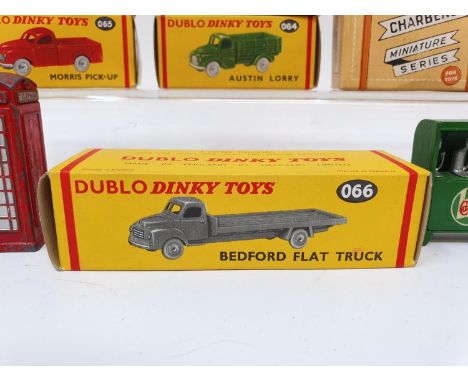 A Dublo Dinky Toys Bedford Flat Truck, 066, boxed, Morris Pick-Up (2), Austin Lorry (2), all boxed, a telephone box, an oil b