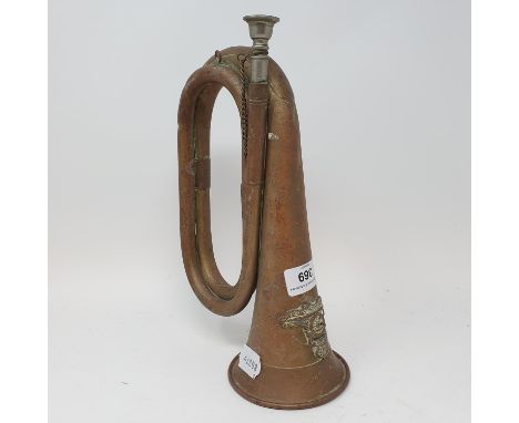 A brass bugle, with a Royal Artillery badge 