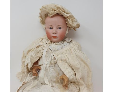 A German bisque headed doll, incised No. 7, Germany, on a composite body, wearing a Christening gown, and another doll (2)Fir