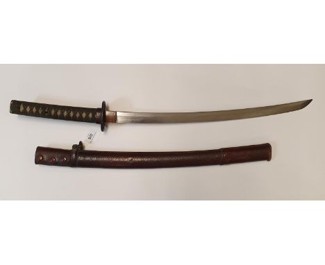 A Japanese katana with a pierced iron tsuba and cord bound fishskin handle, 78 cm, in a leather mounted scabbard, 82.5 cm (ov