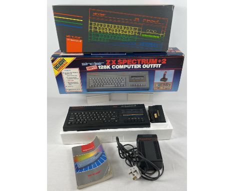 A boxed Sinclair ZX Spectrum +2, complete with power pack, 16k Cheetah interface and instruction manual. Lot also contains or