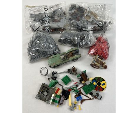 A collection of assorted Lego pieces to include sealed bags and bagged Harry Potter playset. 