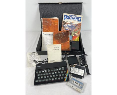 A vintage Sinclair ZX Spectrum personal computer and accessories. Complete with: ZX power supply, introduction manual, Suresh