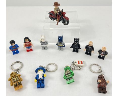 A collection of 12 Lego mini figures and mini figure keyrings. To include Batman, Wonder Women, Superman, Indiana Jones on a 