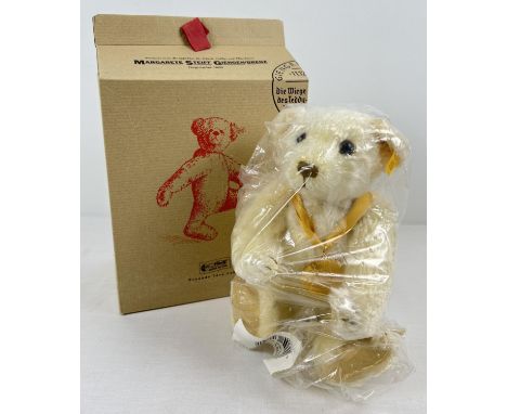 A 12" Margarette Steiff fully jointed, blond haired Millennium teddy bear. With Millennium medal around neck. In original uno