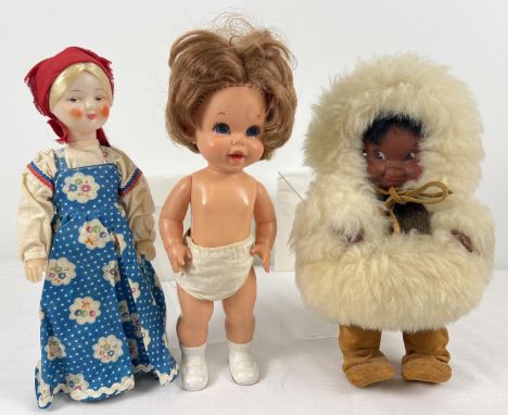 3 vintage toy dolls. A 1967 11" Mattel battery operated Baby Small walks doll; a Regal, Canada Eskimo doll with  leather, fur