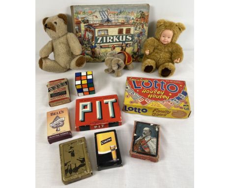A box of assorted vintage toys and games to include rubiks cube, playing cards, boxed games, soft toys and Zircus book. 