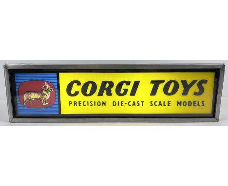 A vintage glass fronted Corgi Toys illuminating shop display sign. Sign reads "Corgi Toys Precision Die-Cast Scale Models". A