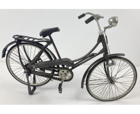 A vintage 11" model of a Bicycle, made in Indonesia. With rubber wheels and plastic handle grips, seat, pedals &amp; pump. Wi