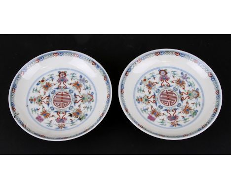 A pair of Chinese shallow dishes decorated with foliate scrolls, blue seal mark to the underside, 16cms (6.25ins) diameter (2