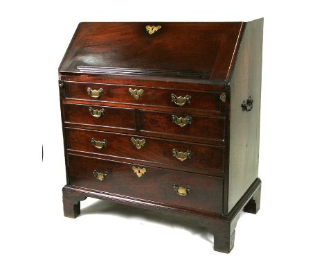 A 19th century mahogany bureau with fall front revealing a fitted interior above an arrangement of five drawers, on bracket f