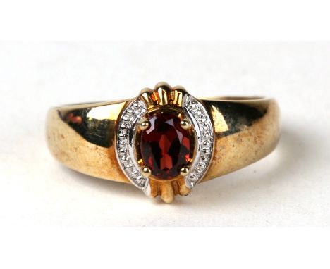 A 9ct gold garnet ring. Approx UK size P. 3.3g