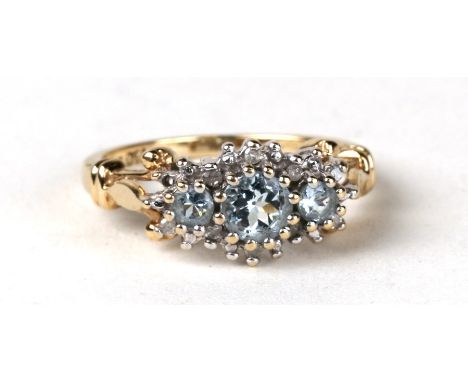 A 9ct gold ring set with three blue topaz and diamonds. Approx UK size N  3.2g