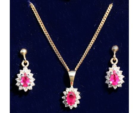 A suite of 9ct gold, ruby and diamond jewellery comprising earrings and matching pendant on chain, cased.Condition Reporttota