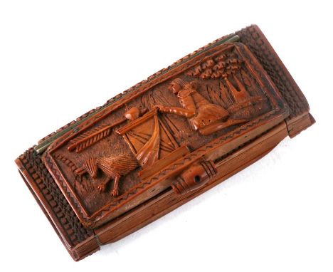 A 19th century coquilla nut snuff box, finely carved with Cupid, 7.5cms (3ins) wide.