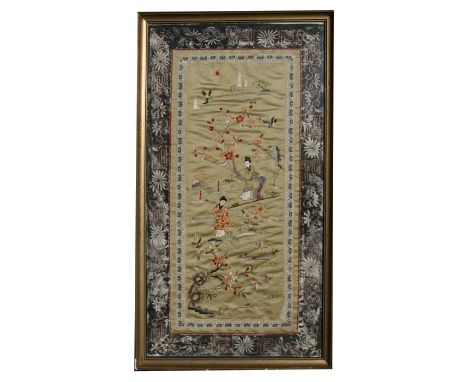 A Chinese silk embroidered panel depicting ladies in a garden, framed &amp; glazed, 33 by 65cms (13 by 25.5ins).