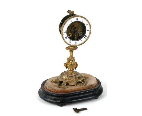 A 19th century French mantle clock with enamel chapter ring with blue Roman numerals, drum movement striking on a bell, on a 