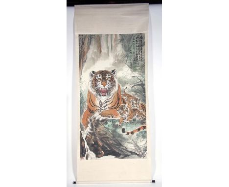 A large Chinese scroll picture depicting a tiger and cubs with calligraphy, 94 by 175cms (37 by 69ins).