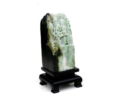 A Chinese green figured jade / hardstone boulder depicting figures in a landscape, 13cms (5ins) high.