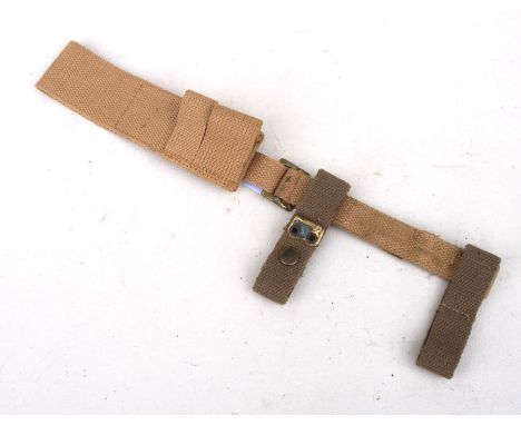 An 08 Pattern bayonet frog with helve strap and carrier. Marked to the reverse of the frog with the War Department arrow and 