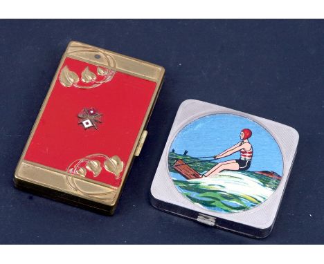 An Art Deco compact, the lid inset with an enamel panel decorated with a water skier; together with an Art Nouveau example wi