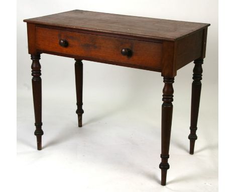 A Victorian mahogany side table with single frieze drawer, on tapering ring turned legs, 85cms (35ins) wide.