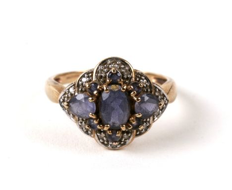 A 9ct gold diamond and amethyst cluster ring. Approx. UK size QCondition ReportCentral stone has two scratches, one other sto