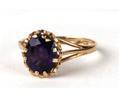 A 9ct gold ring set with an oval cut amethyst. Approx. UK size P. 2.1g