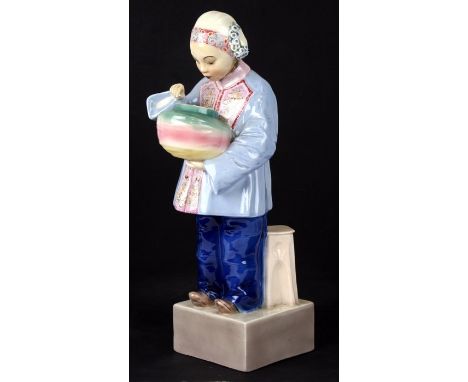 An Art Deco Goldscheider figure of an Asian girl with a bowl, standing by a stool, by Julius Konrad, Hentschel, 36cms (14ins)