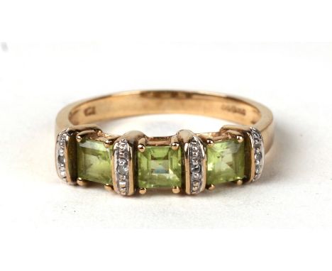 A 9ct gold peridot and diamond ring. Approx UK size P  2.9