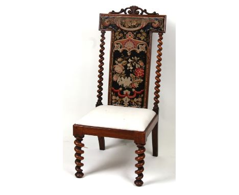 A 19th century Prie Dieu chair with embroidered back panel and barley twist supports.