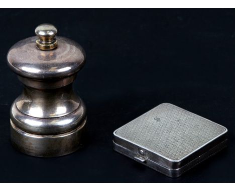 A silver 'Peter Piper' pepper / salt grinder and a silver powder compact. (2)