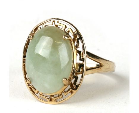 A 9ct gold ring set with a oval jade/hardstone cabochon. Approx UK size K. 3.3g