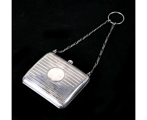 A silver purse on chain with finger ring. 71gCondition ReportBirmingham hallmark but date letter rubbed, small dent front lef