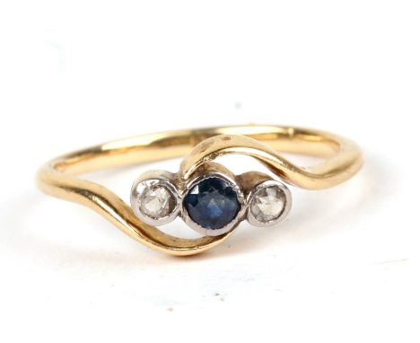 A yellow metal (tests as 18ct gold) diamond and sapphire ring, approx UK size 'M'.