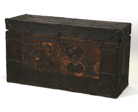 A 18th / 19th century Tibetan tiger skin and leather bound trunk with metal strapwork decoration, (purportedly white tiger's 