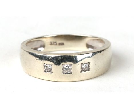 A 9ct white gold gypsy style ring set with three diamonds. Approx Uk size O  3.1g