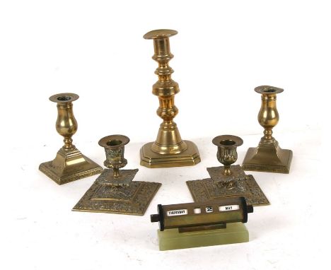 A pair of 17th century style brass dwarf candlesticks, 13cms (5ins) high; together with another similar pair, 9cms (3.5ins) h