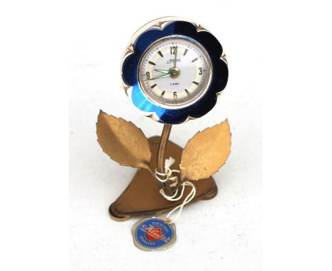A Kaiser novelty alarm clock in the form of a flower, in original box.