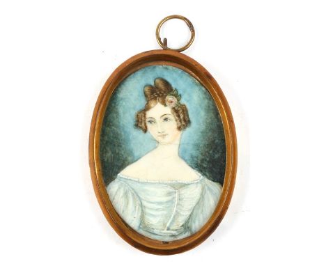 A portrait miniature depicting a young lady wearing a grey dress, in the Georgian style, 4.5 by 6.5cms (1.75 by 2.5ins).