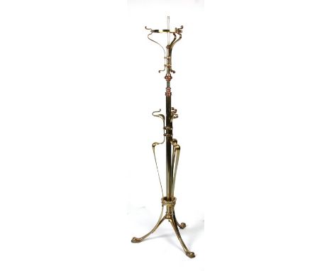An Art Nouveau brass &amp; copper standard lamp with adjustable column.