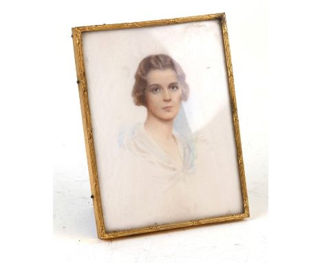 An early 20thy century portrait miniature depicting a young lady, 9 by 11cms (3.5 by 4.75ins).