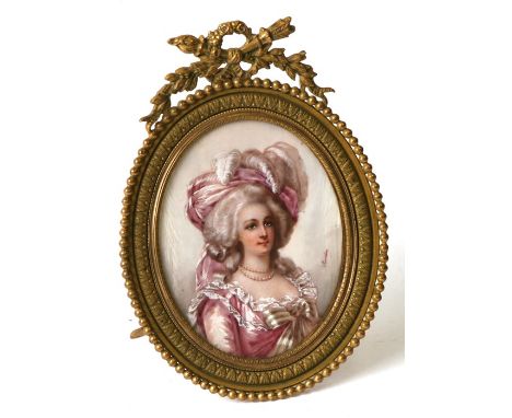 A portrait miniature depicting a lady wearing a pink dress and feathered headdress, signed 'Jourdan', 7.5 by 9.5cms (3 by 3.7