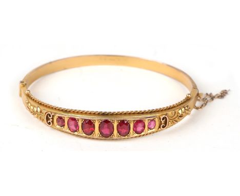 An Edwardian 9ct gold ruby doublet set bangle, boxedCondition ReportGood overall condition seems to be the original box,&nbsp