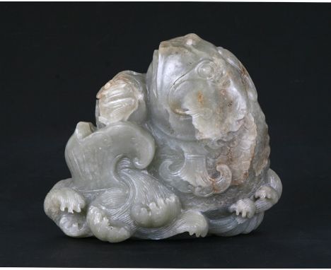 A Chinese jade / hardstone boulder carved in the form of a stylised fish, 14cms (5.5ins) high.Condition ReportSmall losses to