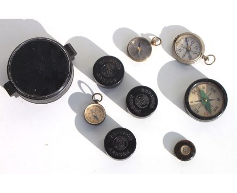 A mid 20th century metal cased large pocket compass 7.5cms (3ins) diameter, together with three early 20th century pocket com