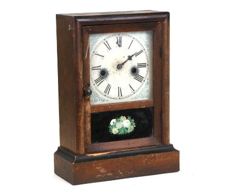 A late 19th century Waterbury Clock Co. mantle clock, the white painted dial with Roman numerals, 25cms (9.75ins) wide.