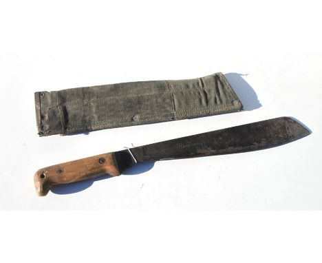 A British Army Martindale machette dated 1963 in its original scabbard. Blade length 33cms (13ins)