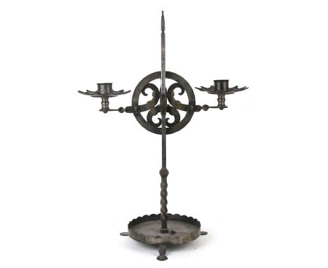 An Arts &amp; Crafts style steel twin light candle holder with holes and loops to reverse for wiring as a lamp if desired, he