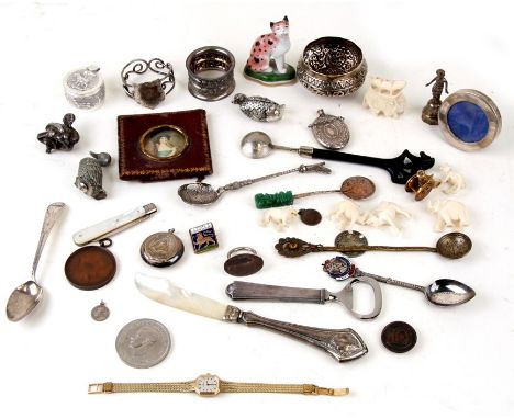 A small circular silver photo frame; together with a silver bladed fruit knife, a silver napkin ring, an Indian white metal b